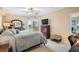 Bright and airy main bedroom with a balcony view and comfortable furnishings including a dresser and nightstands at 4516 Seagull Dr # 509, New Port Richey, FL 34652