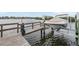 A boat lift on the water with a wooden dock, offering easy access to the waterway at 4516 Seagull Dr # 509, New Port Richey, FL 34652