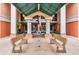 Building entrance with benches featuring dolphin sculpture and fountain at 4516 Seagull Dr # 509, New Port Richey, FL 34652