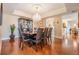 Formal dining room with hardwood floors, chandelier, display cabinet, and a spacious layout at 4516 Seagull Dr # 509, New Port Richey, FL 34652