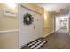 Condo entrance featuring a decorative wreath, welcome mat, and unit number sign at 4516 Seagull Dr # 509, New Port Richey, FL 34652