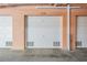 A clean and well-maintained garage with a white door and 'E 20' marked above at 4516 Seagull Dr # 509, New Port Richey, FL 34652