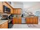 Well maintained kitchen with tile floors, granite counters and modern appliances at 4516 Seagull Dr # 509, New Port Richey, FL 34652