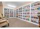 A well-stocked library with floor-to-ceiling bookshelves and comfortable seating at 4516 Seagull Dr # 509, New Port Richey, FL 34652