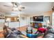 Inviting living room with hardwood floors and comfortable seating adjacent to an open kitchen and bar area at 4516 Seagull Dr # 509, New Port Richey, FL 34652