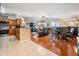 Open-concept living space with hardwood floors and sliding glass doors to a balcony at 4516 Seagull Dr # 509, New Port Richey, FL 34652