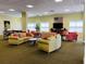 A relaxing lounge area with comfortable sofas, chairs, and a flat-screen TV at 4516 Seagull Dr # 509, New Port Richey, FL 34652