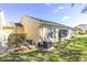 Private backyard with green grass, tasteful landscaping, and mature trees at 4831 Wakefield Ct, New Port Richey, FL 34655