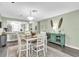 Charming dining area with a lovely sideboard, perfect for hosting intimate dinners with Gathering and friends at 4831 Wakefield Ct, New Port Richey, FL 34655