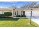 Charming yellow home with a well-manicured lawn and a cozy front porch area perfect for enjoying the outdoors at 4831 Wakefield Ct, New Port Richey, FL 34655