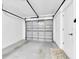 Clean and organized garage with overhead door and ample storage at 4831 Wakefield Ct, New Port Richey, FL 34655