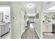 Hallway with stylish flooring and neutral walls, connecting the different living spaces in a harmonious manner at 4831 Wakefield Ct, New Port Richey, FL 34655