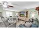 Spacious living room with ample seating, providing a warm and inviting atmosphere for gatherings at 4831 Wakefield Ct, New Port Richey, FL 34655