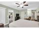 Bedroom with gray flooring and attached bathroom and view to dining area at 4831 Wakefield Ct, New Port Richey, FL 34655