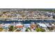 Panoramic aerial view of waterfront homes with access to canals, docks, and a vibrant neighborhood at 4936 Dory Dr, New Port Richey, FL 34652