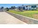 Backyard featuring a well-maintained lawn and a deck with outdoor seating at 4936 Dory Dr, New Port Richey, FL 34652