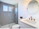 Stylish bathroom features a glass-enclosed shower and a modern vanity with brushed gold faucet at 4936 Dory Dr, New Port Richey, FL 34652