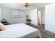 Bedroom featuring neutral walls, window, wood-look floors, and a woven light fixture at 4936 Dory Dr, New Port Richey, FL 34652