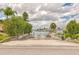 Gated community boat ramp and water access point with signage and mature landscaping at 4936 Dory Dr, New Port Richey, FL 34652