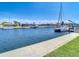 A picturesque canal featuring sailboats and waterfront homes under a sunny sky at 4936 Dory Dr, New Port Richey, FL 34652