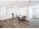 Bright dining area showcasing built-in cabinets, a round table with chairs, and neutral paint at 4936 Dory Dr, New Port Richey, FL 34652