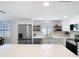 Bright kitchen showcasing a quartz countertop, stainless steel appliances, and lots of natural light at 4936 Dory Dr, New Port Richey, FL 34652