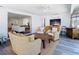 Spacious sunroom extends to the living room creating a seamless flow, furnished with water views at 4936 Dory Dr, New Port Richey, FL 34652