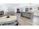 Open-concept living space with kitchen island, dining area, and comfy living room with lots of natural light at 4936 Dory Dr, New Port Richey, FL 34652