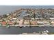 Stunning aerial view of waterfront houses on a canal, offering access to the bay at 5000 Southshore Dr, New Port Richey, FL 34652