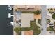 Overhead shot features a pool, boat dock, and well-maintained landscaping in a waterfront backyard at 5000 Southshore Dr, New Port Richey, FL 34652