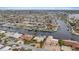 Expansive aerial view showcasing a waterfront community with numerous homes and boat docks along the waterways at 5000 Southshore Dr, New Port Richey, FL 34652