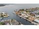 A scenic aerial shot shows waterfront homes nestled along canals with boat docks and pools at 5000 Southshore Dr, New Port Richey, FL 34652
