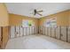 Bedroom featuring tile floors, two windows and exposed framing, ready for customization at 5000 Southshore Dr, New Port Richey, FL 34652