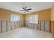 Bedroom with tile floor, bright windows, and framing for customization; ready for design at 5000 Southshore Dr, New Port Richey, FL 34652