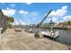 Boat dock on deep water canal featuring boat lift and waterfront access at 5000 Southshore Dr, New Port Richey, FL 34652