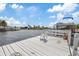 Private dock with boat lift providing direct access to open water and waterfront living at 5000 Southshore Dr, New Port Richey, FL 34652