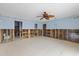 Open living area featuring tile flooring with views into the bathroom and other living spaces at 5000 Southshore Dr, New Port Richey, FL 34652