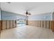 Living area with sliding glass doors to pool, tile floors and new walls ready for rebuild at 5000 Southshore Dr, New Port Richey, FL 34652