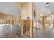 Spacious living room showcasing tile flooring and exposed framing for renovation or customization at 5000 Southshore Dr, New Port Richey, FL 34652