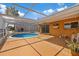 Relaxing pool area features a caged pool, a patio and a spacious yard at 5000 Southshore Dr, New Port Richey, FL 34652