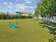 Community dog park featuring agility equipment and a covered bench for pet owners to relax at 553 52Nd N Ave, St Petersburg, FL 33703