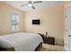 Cozy bedroom with stylish LED lighting, a ceiling fan, and a mounted television for entertainment at 582 8Th Nw St, Ruskin, FL 33570
