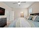 Comfortable bedroom with a view of the ensuite bathroom, providing a relaxing atmosphere at 582 8Th Nw St, Ruskin, FL 33570