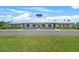 A stunning clubhouse with a modern design, featuring a metal roof and well-manicured landscaping at 582 8Th Nw St, Ruskin, FL 33570