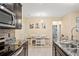Modern kitchen and dining area with stainless steel appliances, granite countertops and decorative wall art at 582 8Th Nw St, Ruskin, FL 33570
