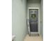 A welcoming front door adorned with a wreath and a personalized 'Home Sweet Home' sign at 582 8Th Nw St, Ruskin, FL 33570