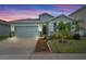 Charming single-Gathering home featuring a two-car garage and well-manicured landscaping at 582 8Th Nw St, Ruskin, FL 33570