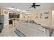 Spacious, open-concept kitchen and living area with a neutral palette, and functional design at 582 8Th Nw St, Ruskin, FL 33570
