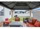 Charming outdoor gazebo with comfortable seating, a fire pit, and a view of the green backyard at 582 8Th Nw St, Ruskin, FL 33570