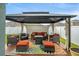 Inviting outdoor lounge area featuring comfortable seating and a stylish gazebo for relaxation and gatherings at 582 8Th Nw St, Ruskin, FL 33570
